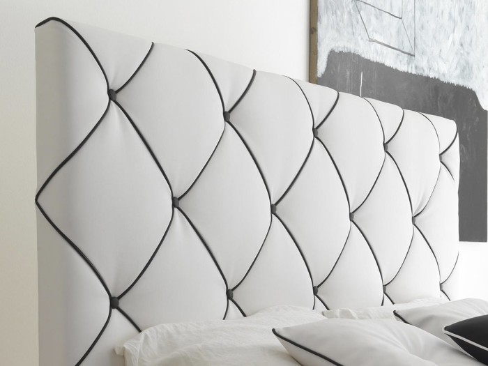 Перетяжка изголовья кровати белой экокожей